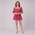 Ellery mini dress in red with a white lace collar, front view