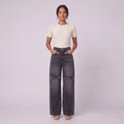 Enid baggy jeans in washed black, full-length view with hands in pockets