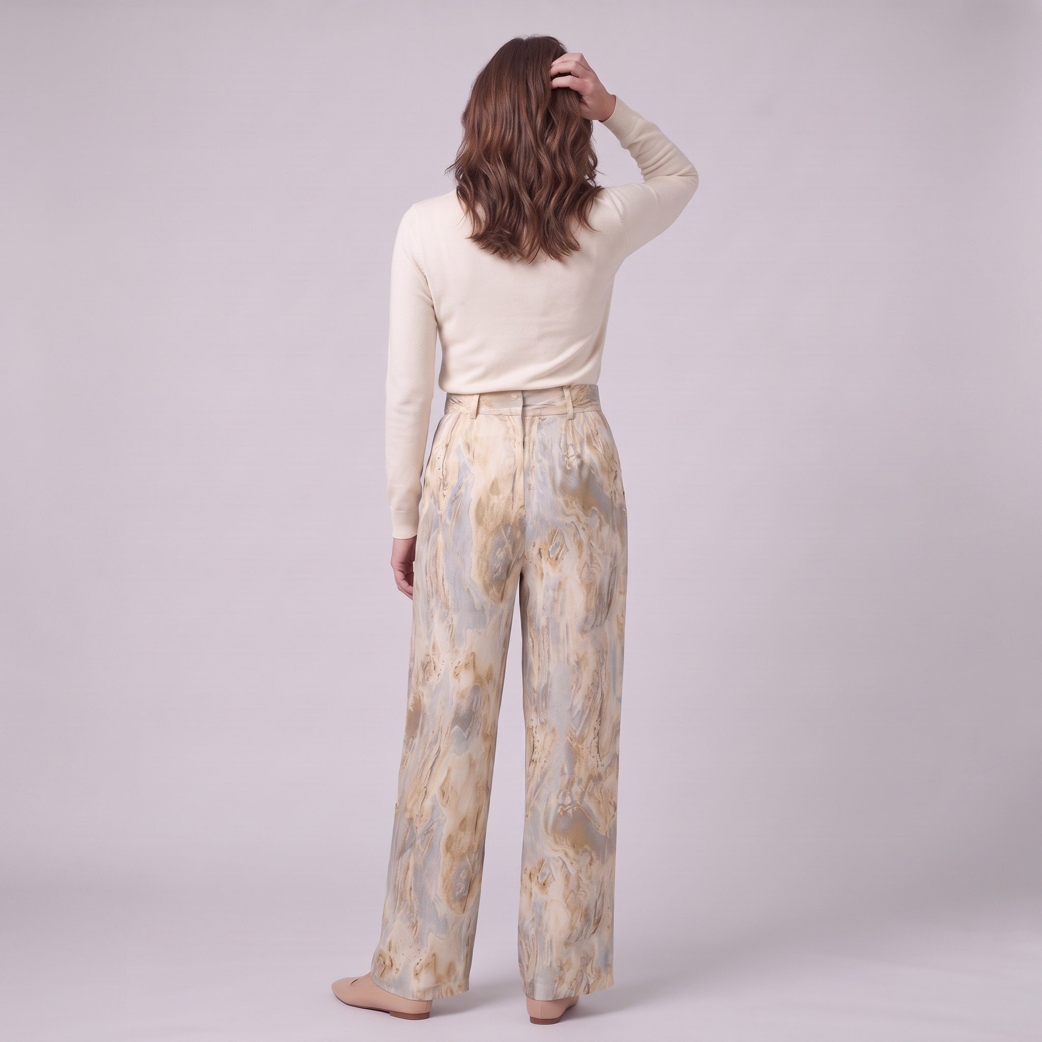 Evadne printed wide leg trousers in beige marble print, back view on model