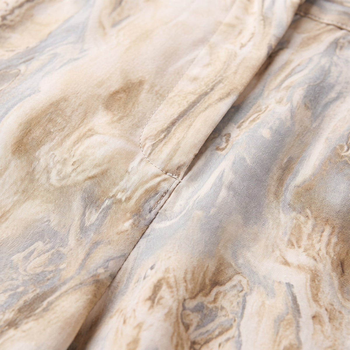 Evadne printed trousers fabric detail, watercolour marble print close-up