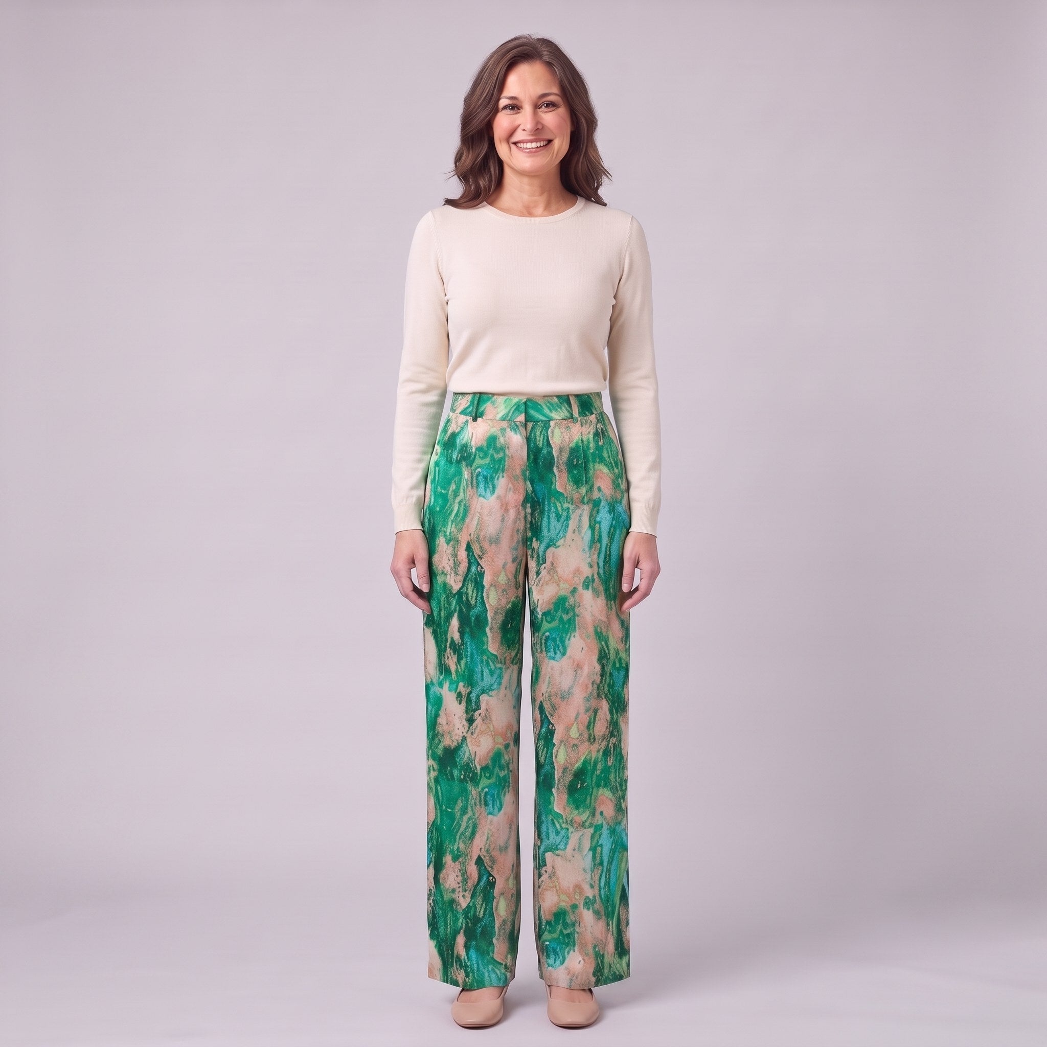 Evadne printed wide leg trousers in emerald green marble print, front view on model