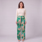 Evadne printed wide leg trousers in emerald green marble print, front view on model