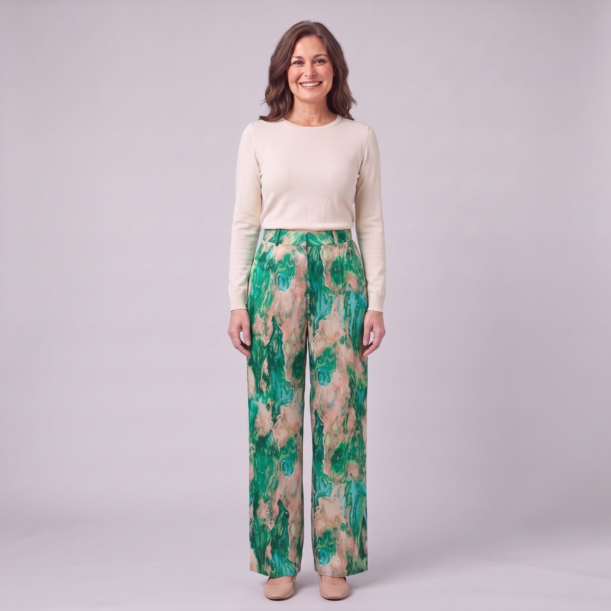 Evadne printed wide leg trousers in emerald green marble print, front view on model