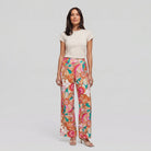 Pamela Boutique pink floral wide-leg flared trousers, model view