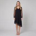 Black evening dress with sheer sleeves and a fluid skirt, view 1