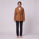 Ghislaine quilted belted jacket in caramel with shawl collar, front view on model