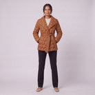 Ghislaine quilted belted jacket in caramel, full front view on model
