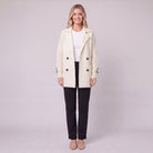 Gwenneth double-breasted knit coat in cream white, front view on model
