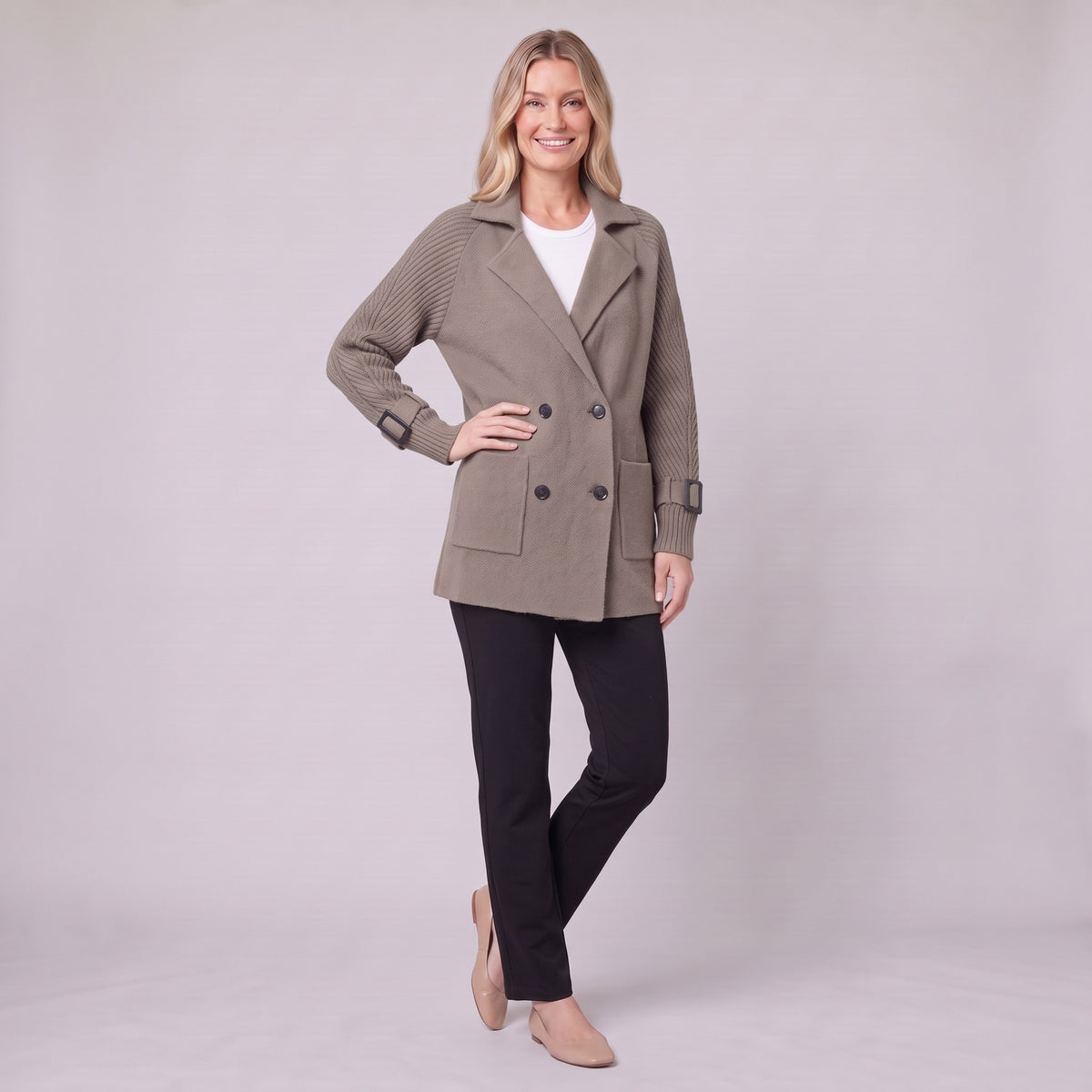Gwenneth knit coat in taupe, three-quarter view showing the cable-knit sleeve and buckled cuff