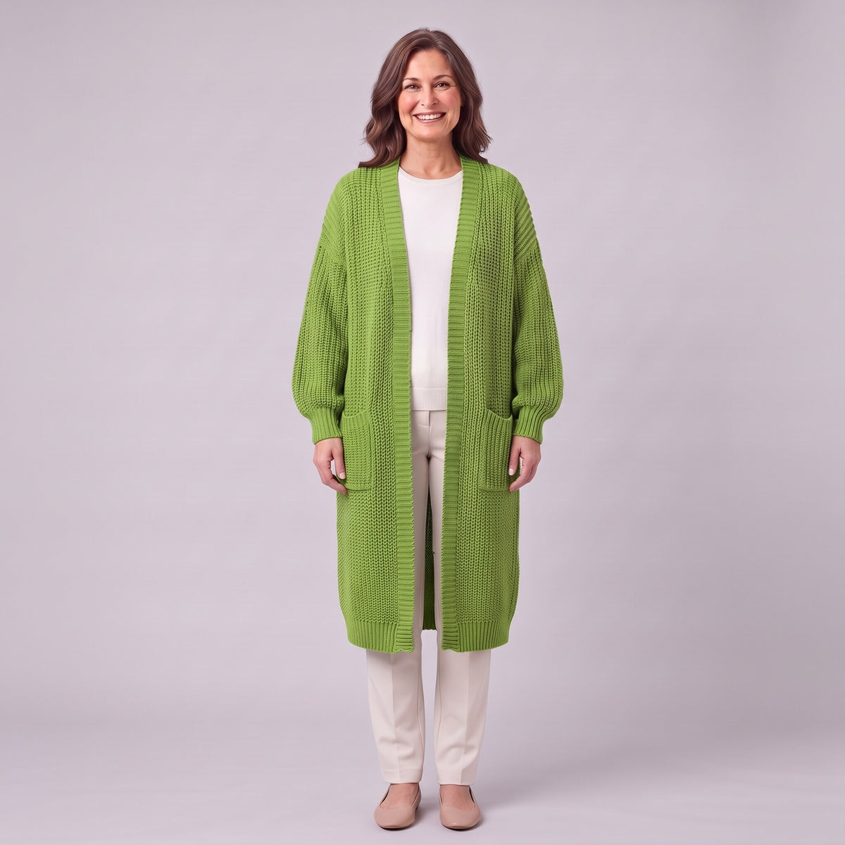 Halla longline chunky rib cardigan in apple green, front view on model