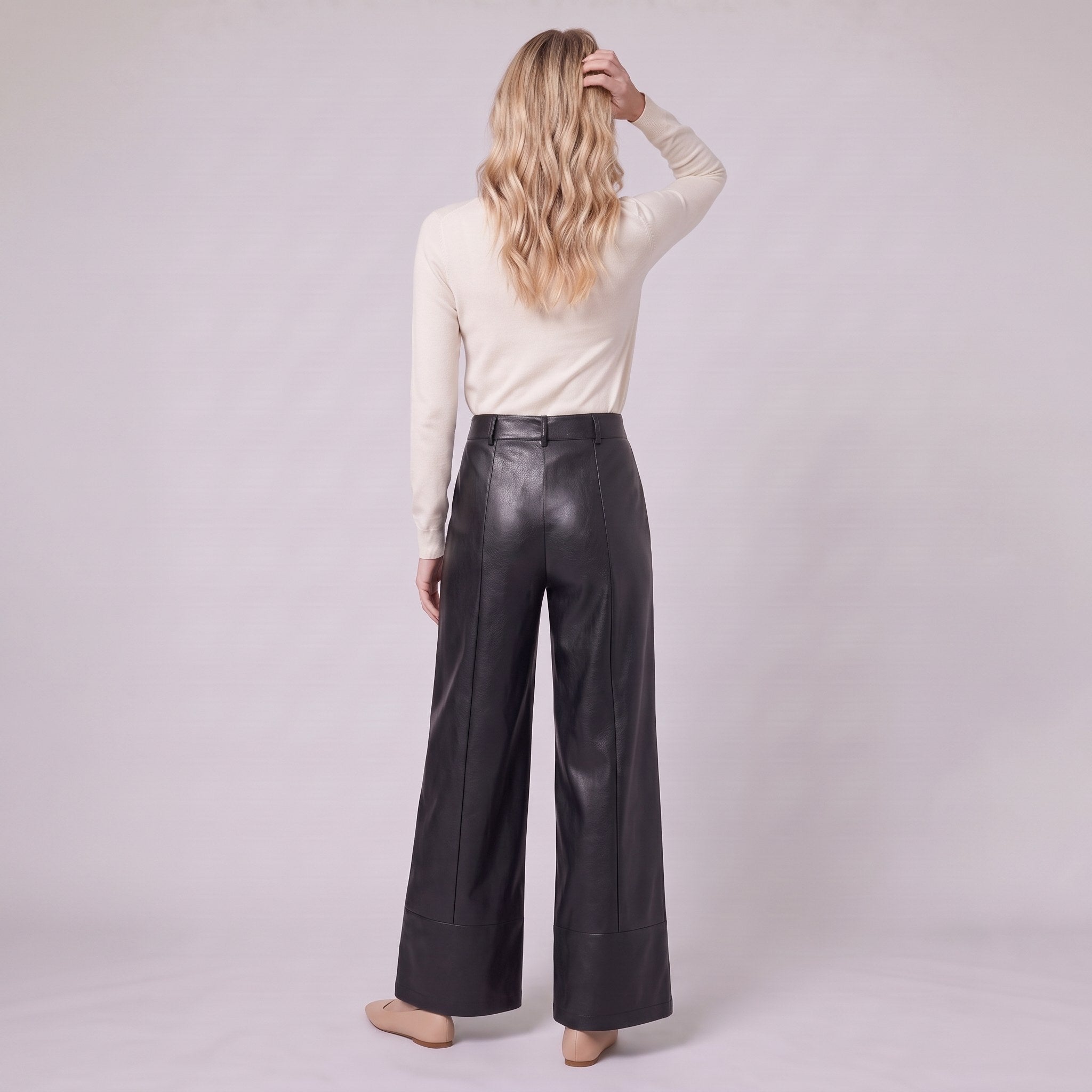 Helka faux leather wide leg trousers in black, back view on model