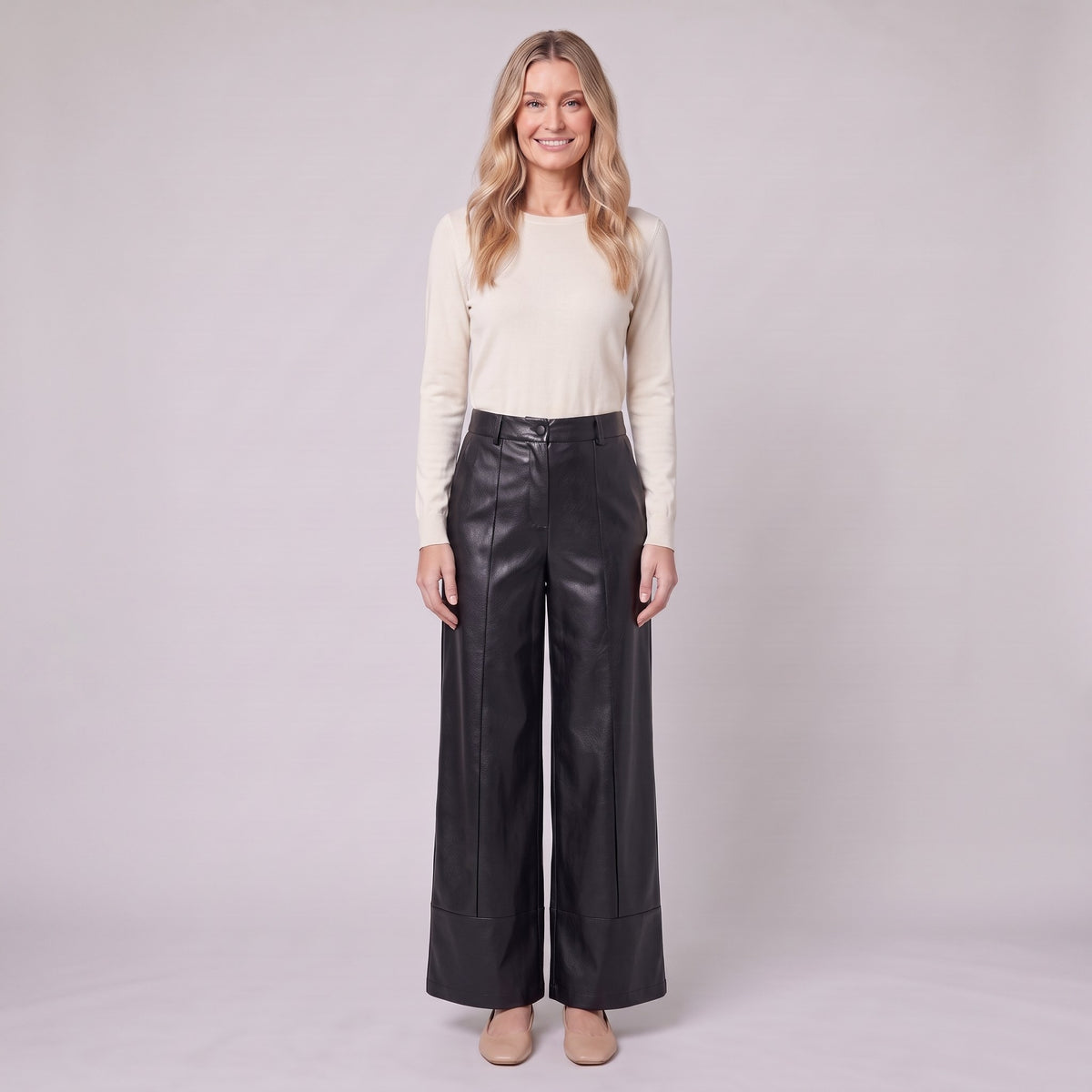 Helka faux leather wide leg trousers in black, front view on model