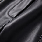 Helka faux leather trousers fabric detail, smooth glossy PU close-up