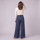 Hesper pleated wide leg trousers in navy blue, back view on model