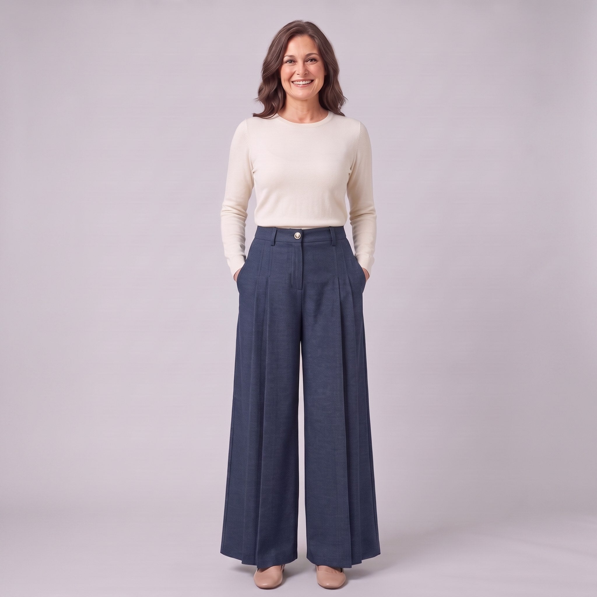 Hesper pleated wide leg trousers in navy blue, full-length view with hands in the pockets