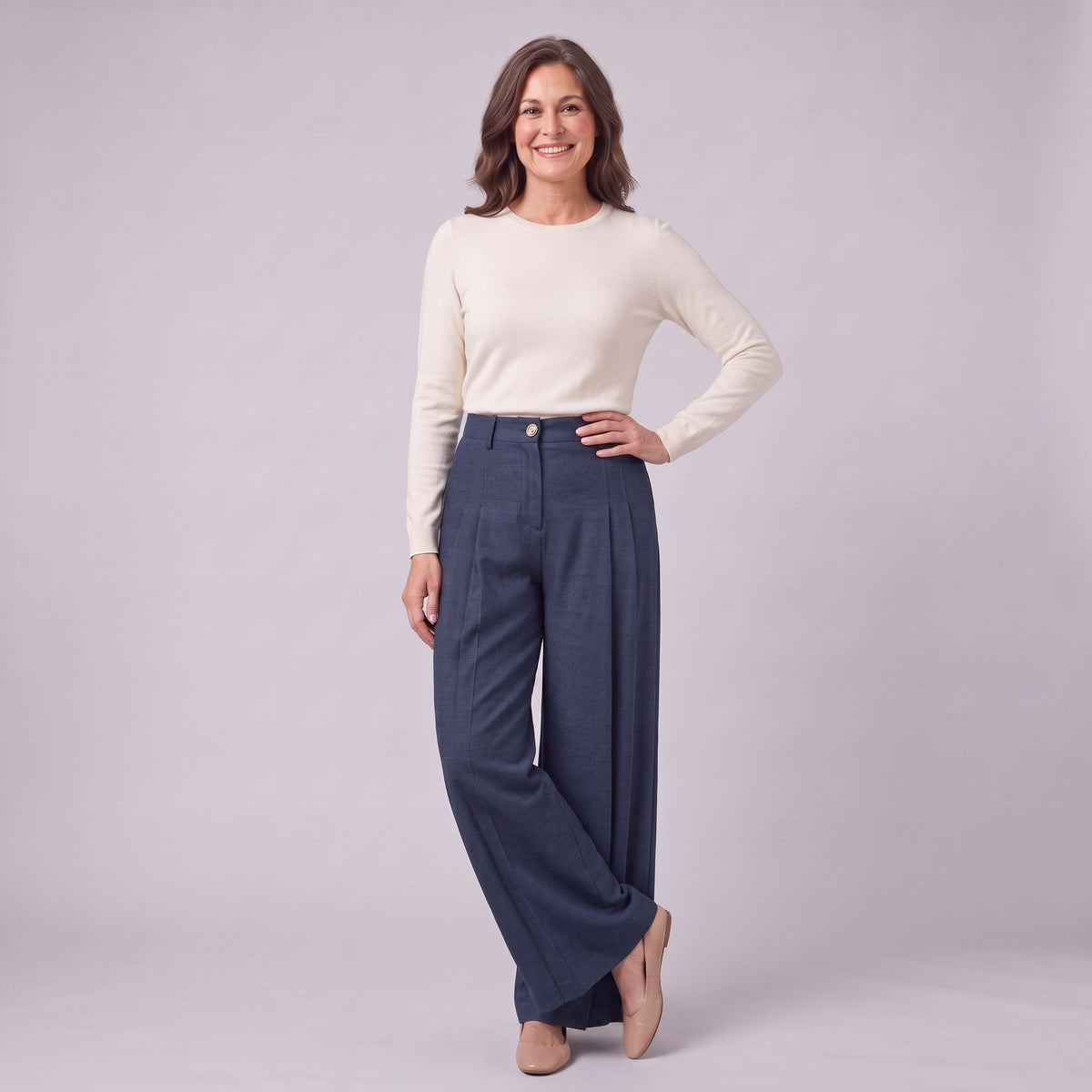 Hesper pleated wide leg trousers in navy blue, three-quarter view showing the deep pleats