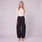 Inara baggy cargo trousers in black, front view on model