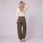 Inara baggy cargo trousers in dark olive brown, back view on model