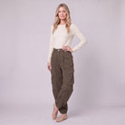Inara baggy cargo trousers in dark olive brown, three-quarter view showing the cargo pockets