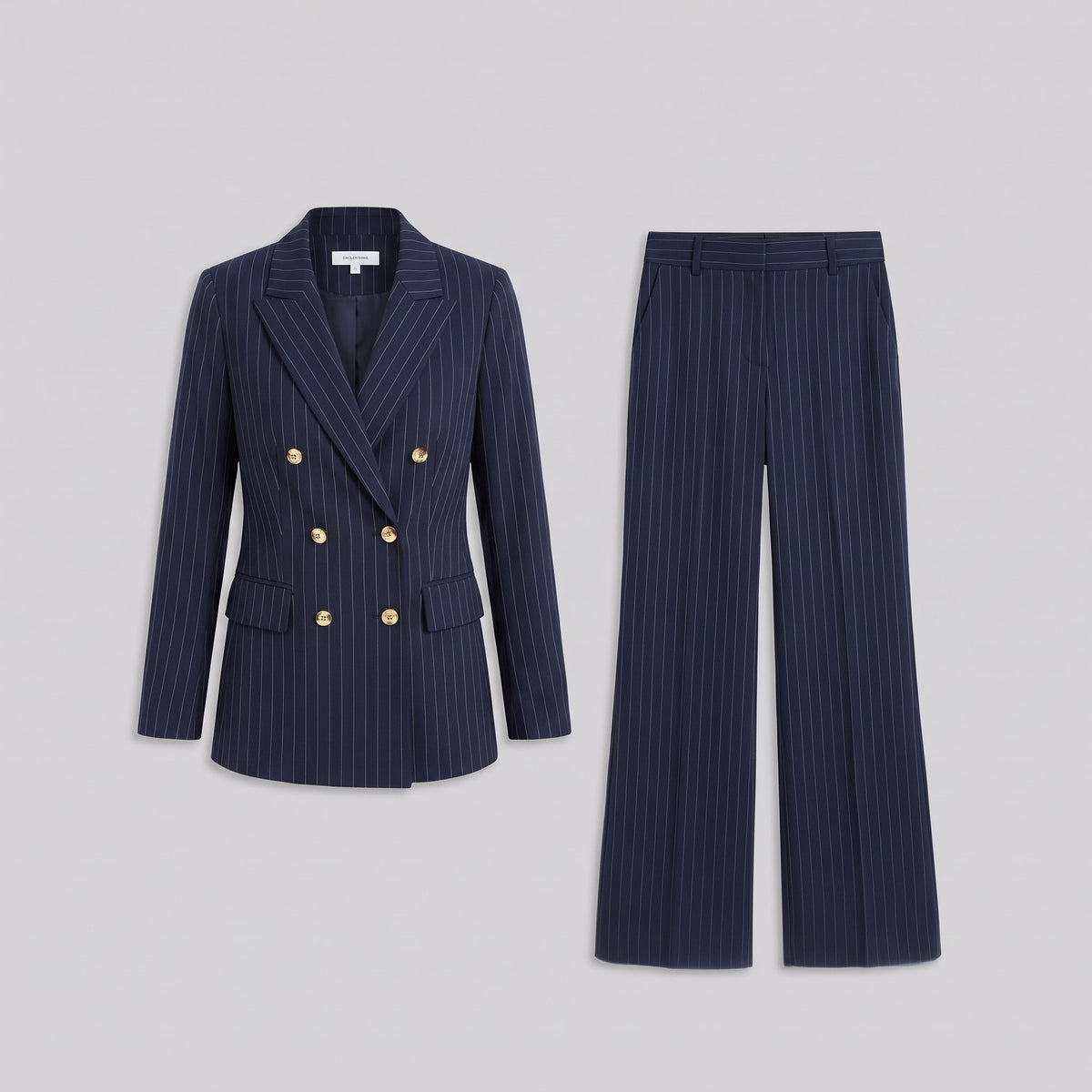 Iris navy pinstripe blazer and trousers shown without a model on a light grey background