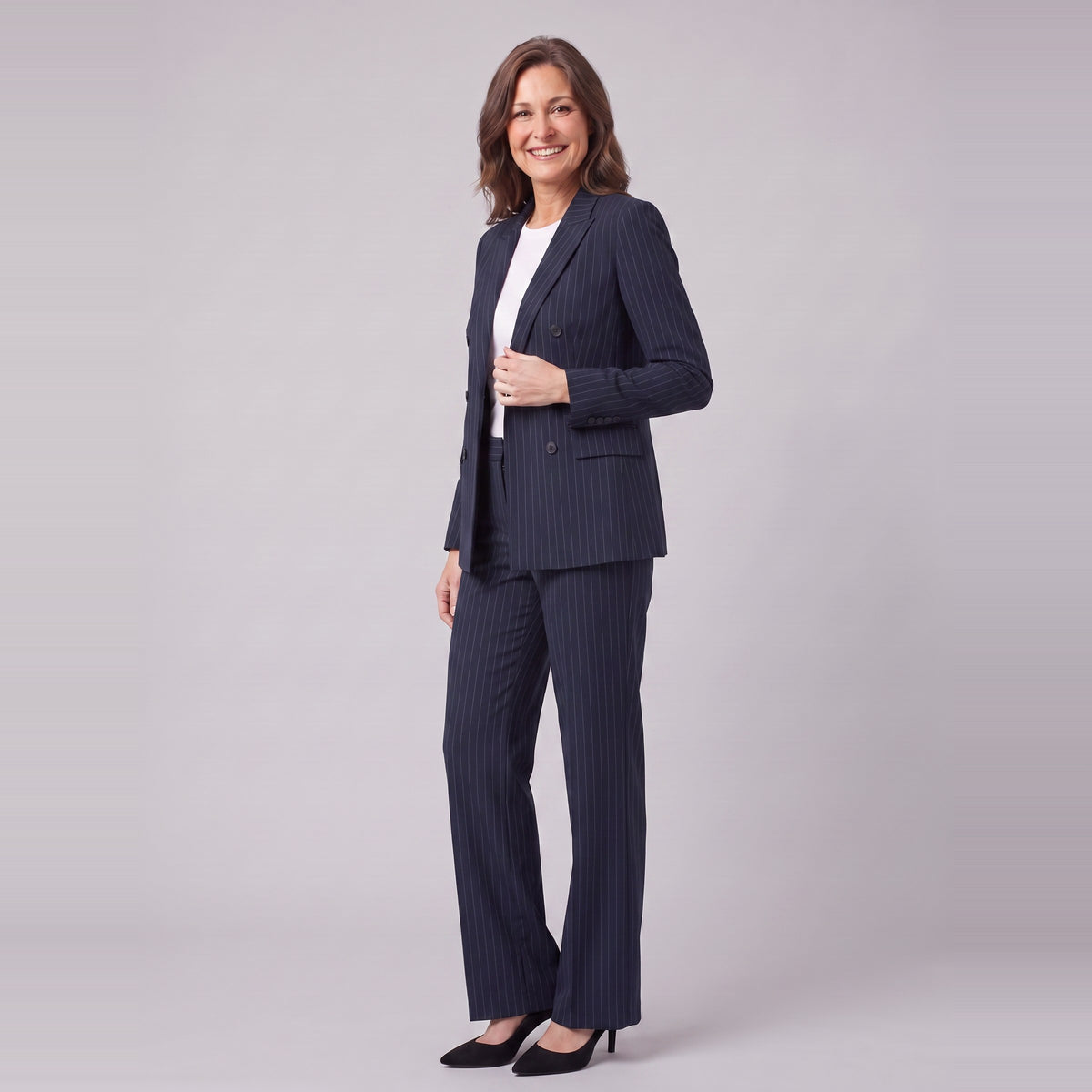 Iris navy pinstripe suit, three-quarter view showing the lapel