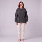 Kaia oversized sweatshirt in dark charcoal grey, front view on model
