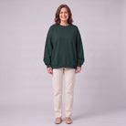 Kaia oversized sweatshirt in dark forest green, front view on model