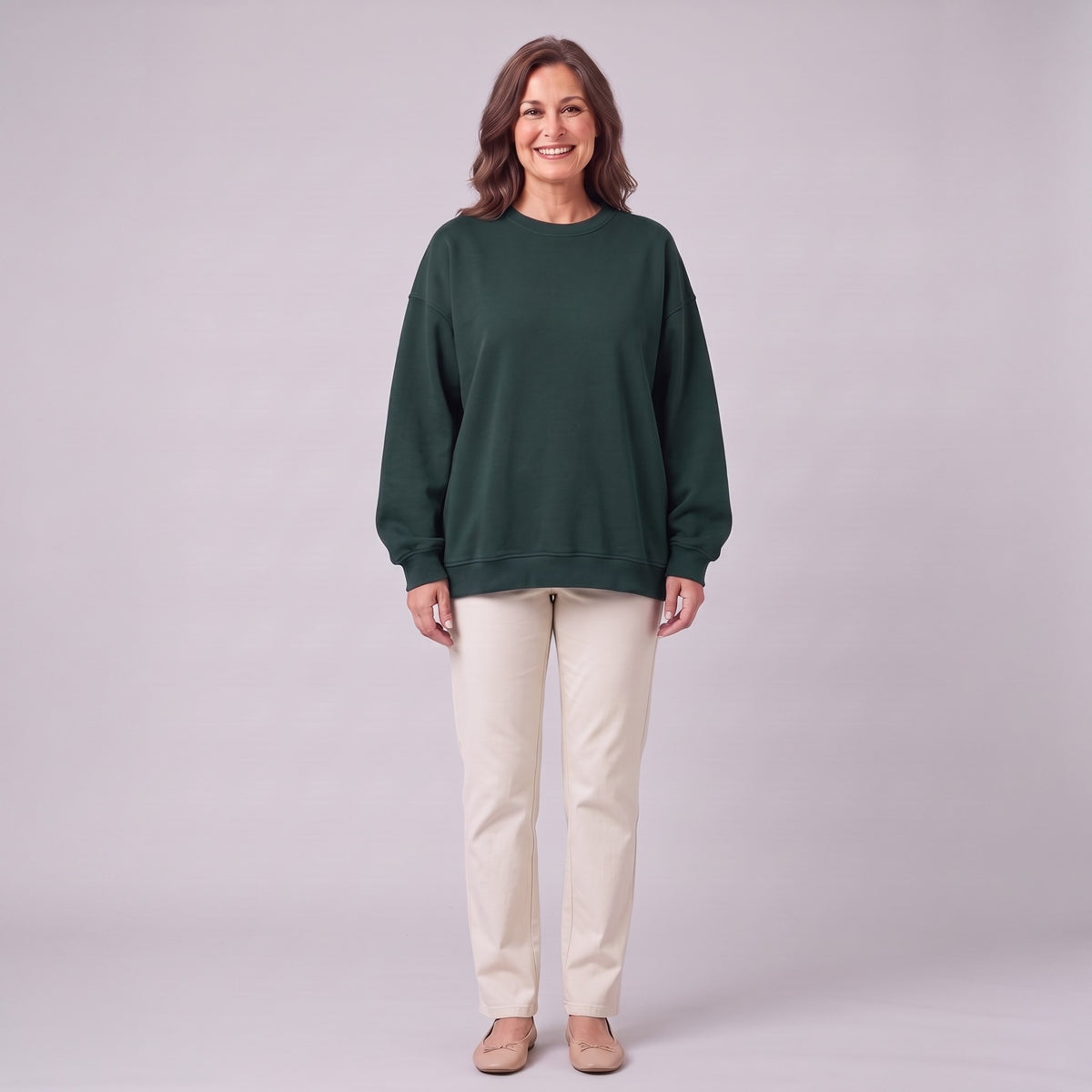 Kaia oversized sweatshirt in dark forest green, front view on model