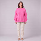 Kaia oversized sweatshirt in bright fuchsia pink, front view on model