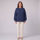 Kaia oversized organic cotton sweatshirt in navy, front view on model