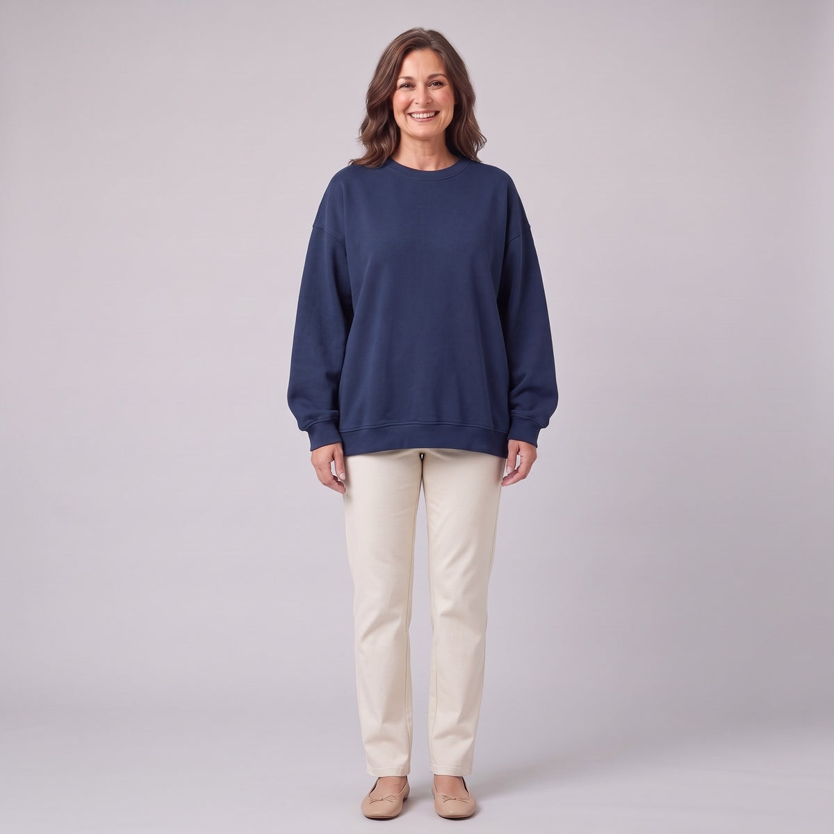Kaia oversized organic cotton sweatshirt in navy, front view on model