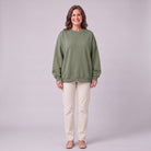 Kaia oversized sweatshirt in sage army green, front view on model