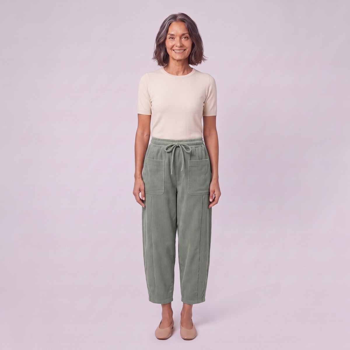 Kerensa barrel leg corduroy trousers in sage green, front view on model