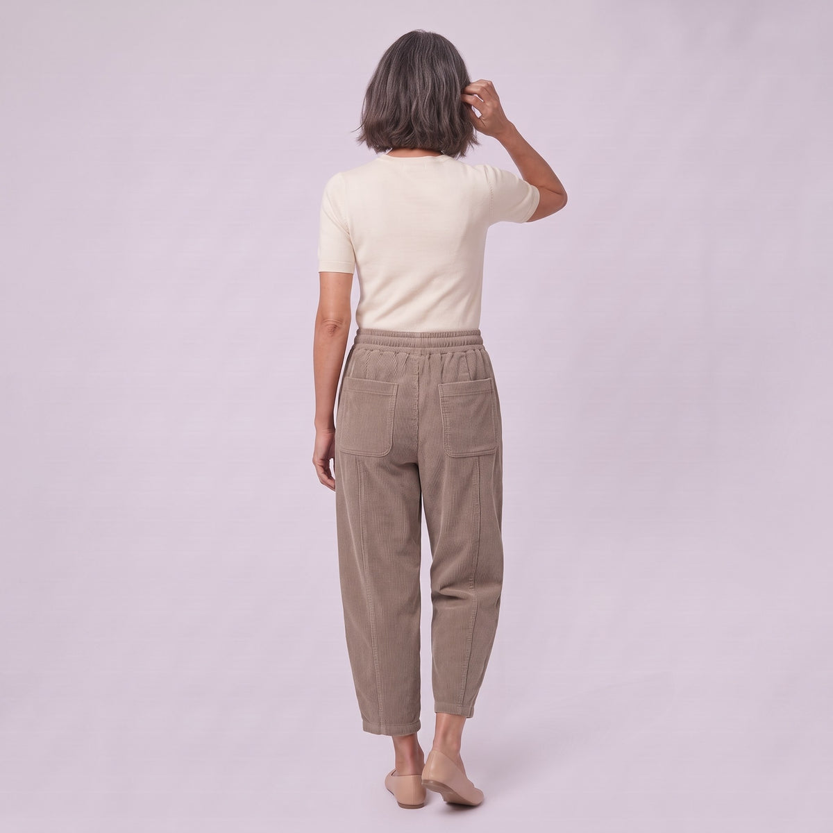 Kerensa barrel leg corduroy trousers in khaki taupe, back view on model