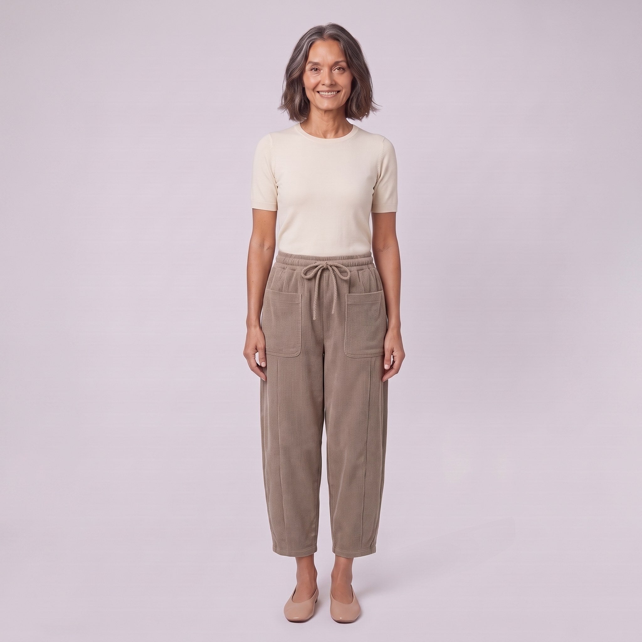 Kerensa barrel leg corduroy trousers in khaki taupe, drawstring waist, front view on model