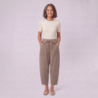Kerensa barrel leg corduroy trousers in khaki taupe, full-length view with hands in patch pockets