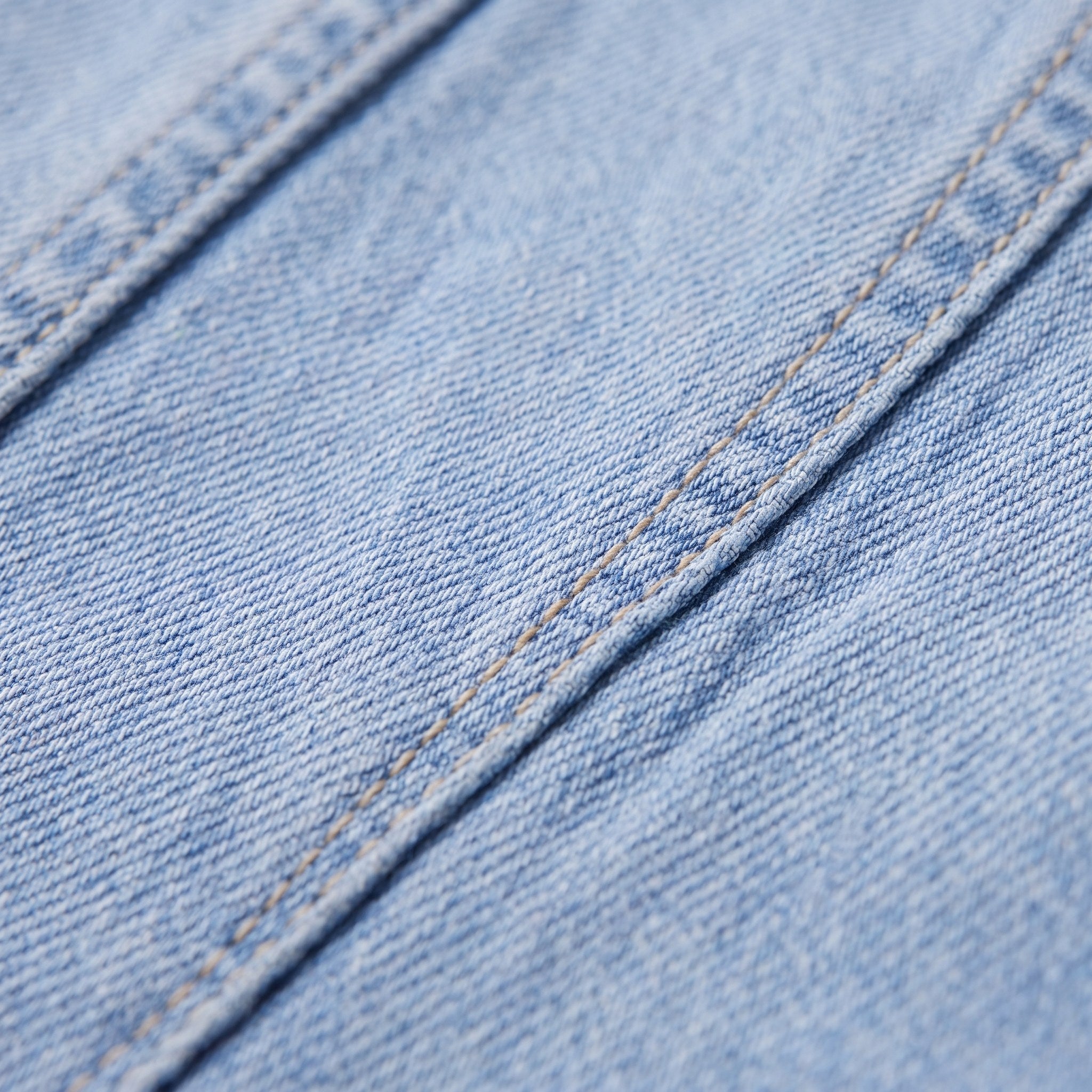 Lavinia flared jeans fabric detail, light wash stretch denim and topstitching close-up