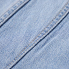 Lavinia flared jeans fabric detail, light wash stretch denim and topstitching close-up