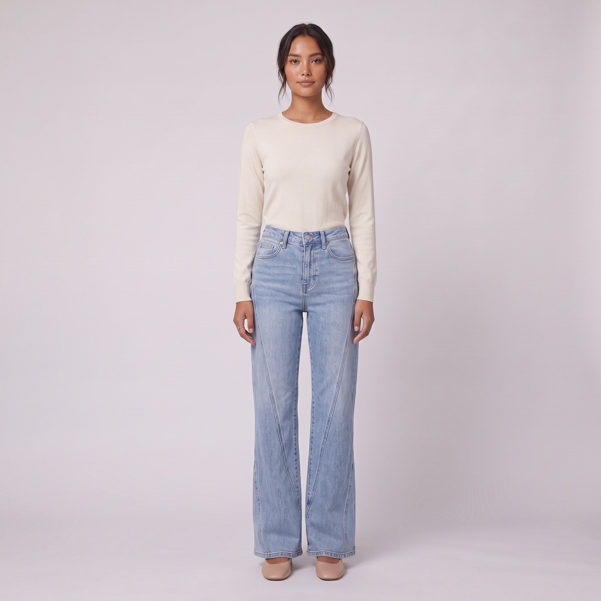 Lavinia high rise flared jeans in light wash blue denim, front view on model