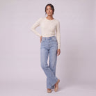 Lavinia high rise flared jeans in light wash blue denim, three-quarter view showing the flare