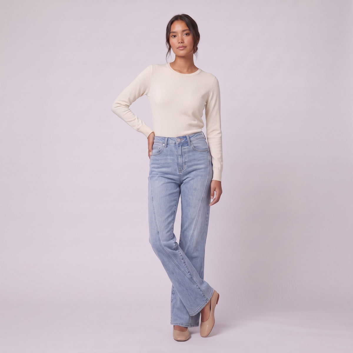 Lavinia high rise flared jeans in light wash blue denim, three-quarter view showing the flare