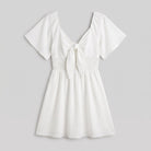 Mini dress with a V-neck and bow tie detail, flat lay