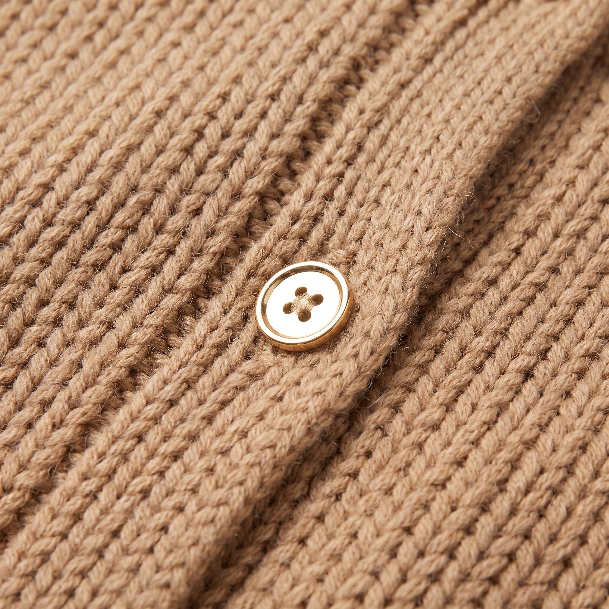 Magali oversized cardigan in camel, close-up of the soft knit and gold-tone button