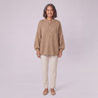 Magali oversized cardigan in camel, front view on model with cream trousers