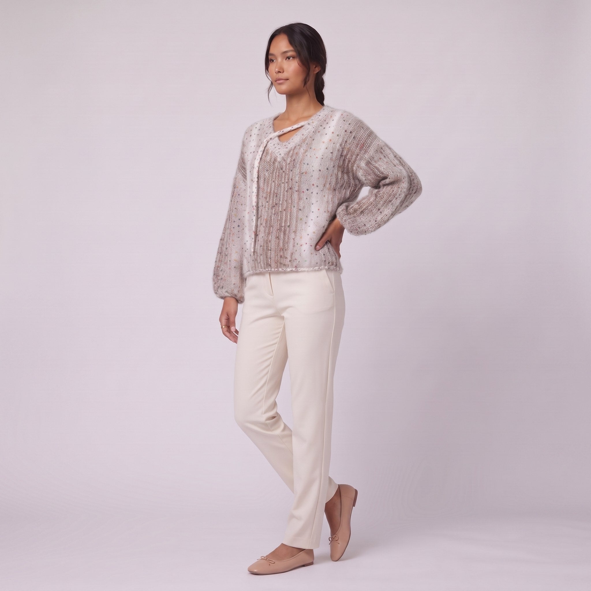 Nerissa speckled knit sweater in oatmeal, three-quarter view showing the balloon sleeves