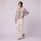 Nerissa speckled knit sweater in oatmeal, three-quarter view showing the balloon sleeves