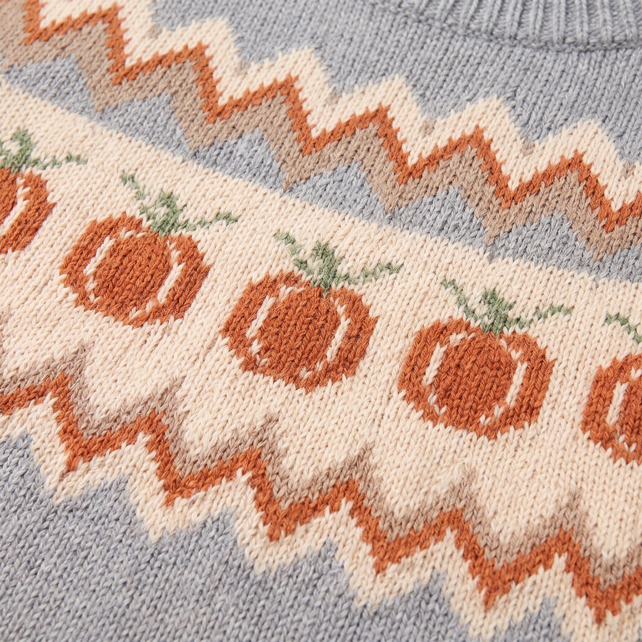 Nieve sweater fabric detail, orange pumpkin fair isle jacquard knit on grey wool