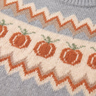 Nieve sweater fabric detail, orange pumpkin fair isle jacquard knit on grey wool