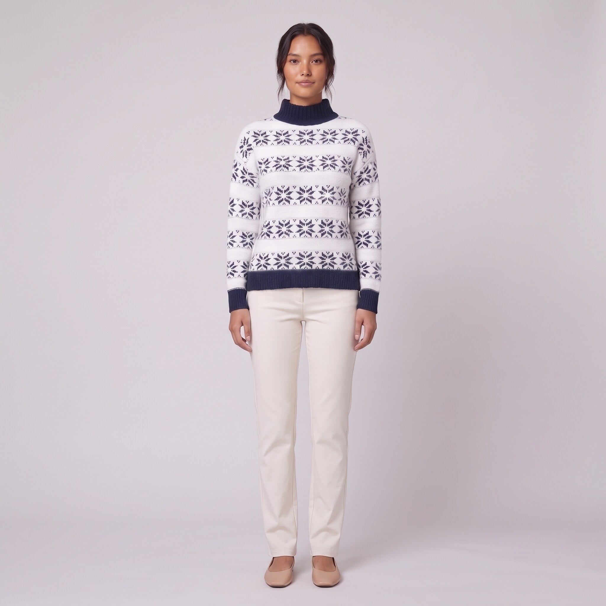 Nova snowflake knit sweater in navy blue Nordic pattern, front view on model