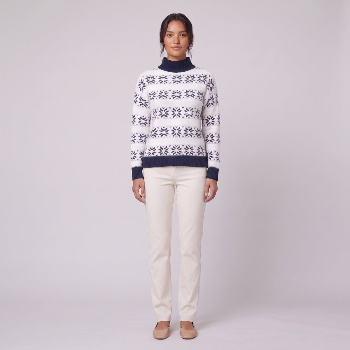 Nova snowflake knit sweater in navy blue Nordic pattern, front view on model